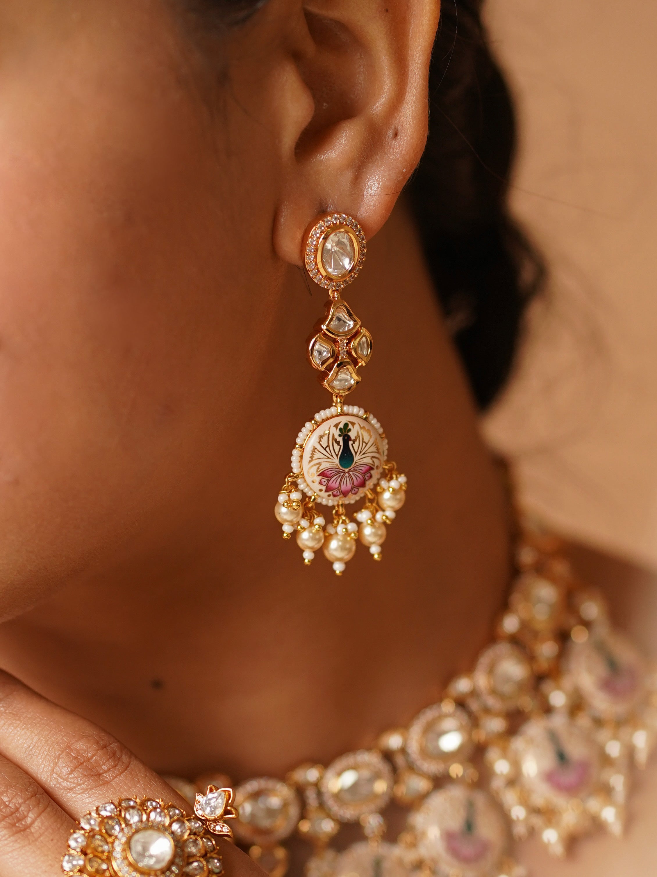 Close-up of meenakari peacock necklace set with gold-plated finish